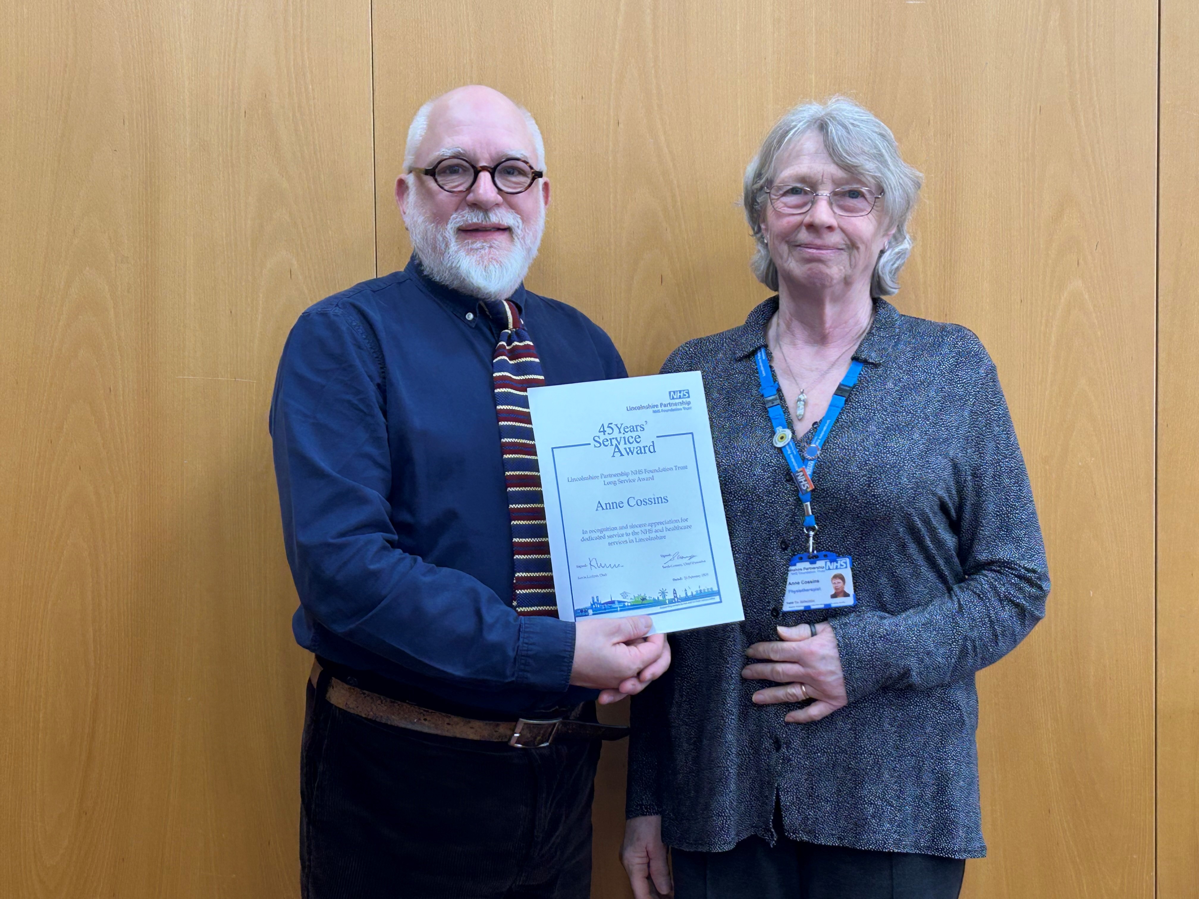 Left, Kevin Locker; right, Anne Cossins with her Long Service Award